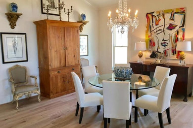 Inspiration for a mid-sized traditional open plan dining in Little Rock with white walls, light hardwood floors, no fireplace and beige floor.