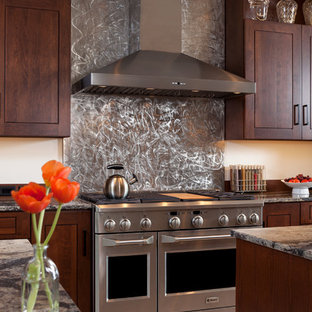 Photo of a large transitional galley kitchen pantry in Other with an undermount sink, flat-panel cabinets, medium wood cabinets, quartz benchtops, brown splashback, stainless steel appliances, porcelain floors and multiple islands.