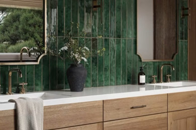 Bathroom - modern green tile porcelain tile, black floor and double-sink bathroom idea in Los Angeles with light wood cabinets, marble countertops, white countertops and a built-in vanity