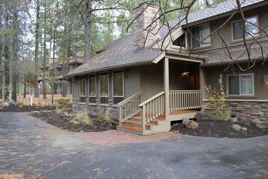 Inspiration for a timeless beige mixed siding exterior home remodel in Other