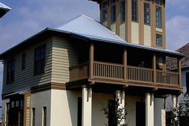 Mid-sized transitional beige three-story mixed siding exterior home idea in Miami