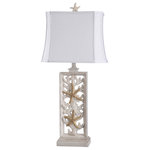Stylecraft - Hyman 33" Table Lamp - The South Cove table lamp is designed with a cast coastal motif body and rectangular shade with a subtle waist to give it a clean seaside feel. Equipped with a 3-way switch, this tableside lamp helps introduce a degree of ambiance to any room, from a closed in porch to a bedside and beyond. Add its spare design and ocean-inspired accents and you have a nautical style that can't be beat.