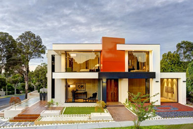 Design ideas for a contemporary two-storey exterior in Melbourne with a flat roof.
