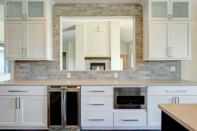 Example of a transitional kitchen design in Denver