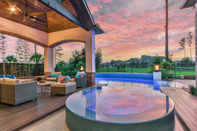 Inspiration for a large transitional backyard concrete and rectangular natural hot tub remodel in Houston
