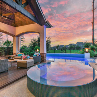 ヒューストンの大きい長方形トランジショナルスタイルのおしゃれなプール (コンクリート板舗装 ) の写真