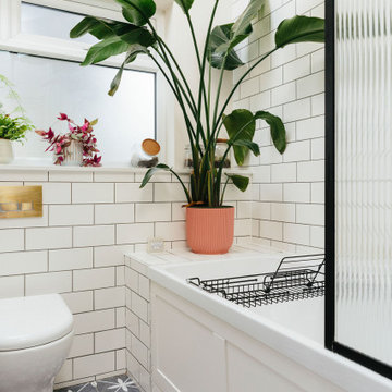 Pink & green bathroom with mix of tiles & patterns