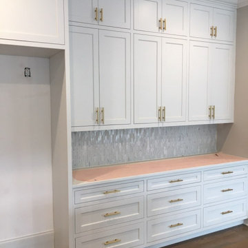 Cabinet hardware install continues
