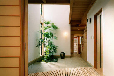 Photo of a small country home design in Osaka.