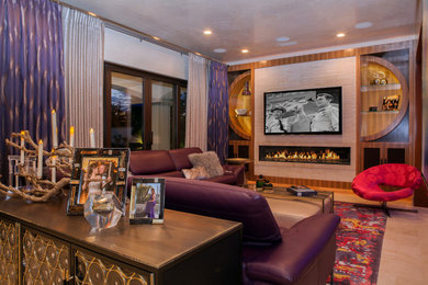 Home theater - mid-sized modern enclosed beige floor home theater idea in Orange County with white walls and a wall-mounted tv
