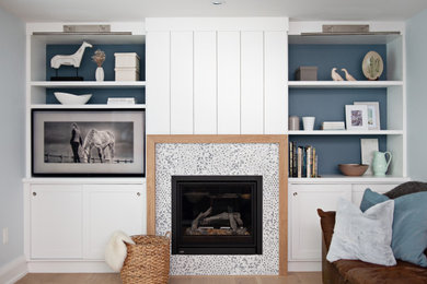 Living room - mid-sized transitional light wood floor and beige floor living room idea in Toronto with gray walls, a standard fireplace, a tile fireplace and no tv