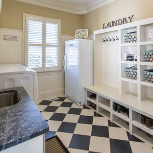 Medium sized traditional galley utility room in Raleigh with a submerged sink, open cabinets, white cabinets, soapstone worktops, beige walls, porcelain flooring and a side by side washer and dryer.
