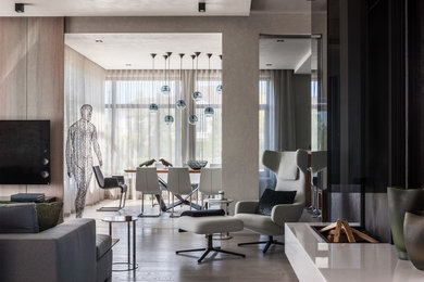 Photo of a contemporary open concept living room in Moscow with grey walls and beige floor.