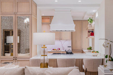 Inspiration for a transitional u-shaped coffered ceiling kitchen pantry remodel in New York with shaker cabinets, light wood cabinets, wood countertops, white backsplash, stone slab backsplash, paneled appliances and white countertops