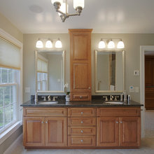 vanities with linen closets at each end