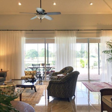 Traversing sheer drapery for a living room slider wall