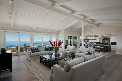 Large transitional open concept dark wood floor and brown floor living room photo in Santa Barbara with beige walls, a standard fireplace and a stone fireplace