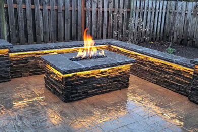 Patio - large contemporary backyard concrete paver patio idea in Portland with a fire pit