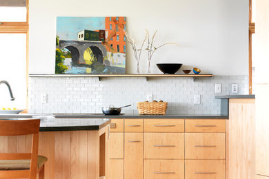 Trendy kitchen photo in Burlington with flat-panel cabinets, light wood cabinets, white backsplash and subway tile backsplash