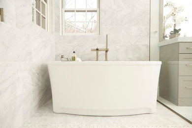Large transitional master gray tile and marble tile marble floor and gray floor bathroom photo in Chicago with recessed-panel cabinets, gray cabinets, a two-piece toilet, gray walls, an undermount sink and marble countertops
