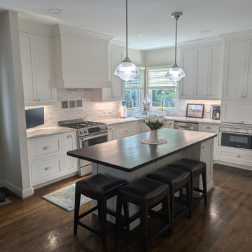 White inset cabinetry with walnut custom accents