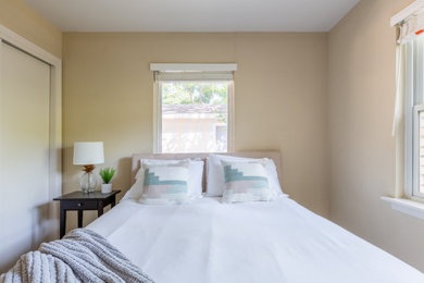 Example of a minimalist bedroom design in Austin