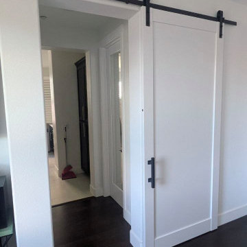 Lucia 1299 White Barn door with black hardware and softcloses