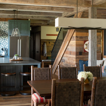 Reclaimed Wood Timbers, Paneling, and Flooring in Rustic Cabin Open Kitchen