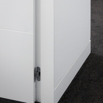 The clean-line look of this door opening is furthered by the installation of Roc