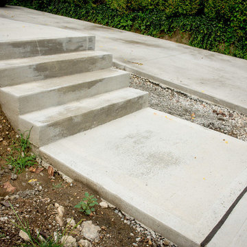 Clean Concrete Drive with Bold Brick Accents