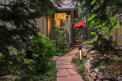 This is an example of a small transitional partial sun stone and wood fence garden path in Denver for summer.