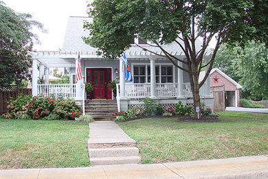 Small blue exterior home idea in Other