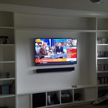 TV mounting with custom soundbar