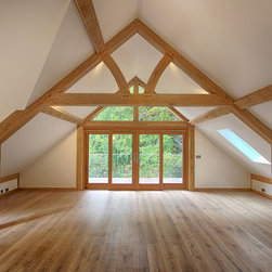 Inside an oak garage with room above featured trusses - Patio Doors & Bi-fold Doors