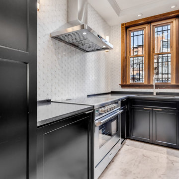 Two-Toned White and Dark Hunter Green Cabinets with Black Quartz Countertop