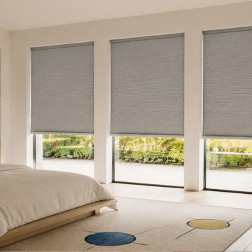Gray Honeycomb Blinds on Large Bedroom Windows