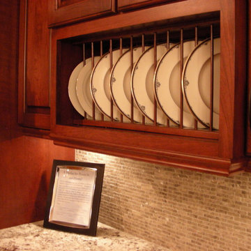 Rich colored cherry cabinets with glass accents