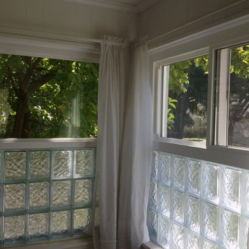 Glass blocks combined with vinyl slider and picture windows