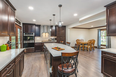 Kitchen remodeling in Burke, VA with gleaming backsplash tiles & wooden cabinets