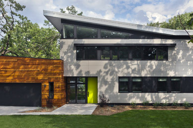 Design ideas for a mid-sized contemporary two-storey grey exterior in Minneapolis with mixed siding.