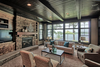Living room - transitional open concept carpeted and beige floor living room idea in Other with beige walls, a standard fireplace, a stone fireplace and a media wall