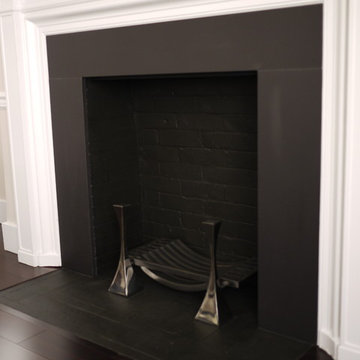 Fireplace refaced with Dekton matte black domoos