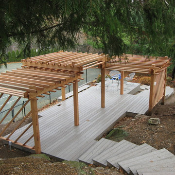 Shaded deck overlooking tennis court
