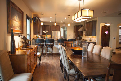 Large elegant dark wood floor and brown floor great room photo in Orange County with beige walls