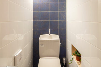 Inspiration for a small traditional cloakroom in Tokyo Suburbs with flat-panel cabinets, grey cabinets, ceramic tiles, laminate floors, a built-in sink, tiled worktops, grey floors, grey worktops, a built in vanity unit, a wallpapered ceiling and white walls.