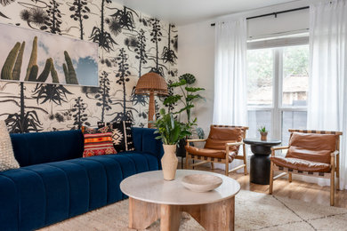 Southwest vinyl floor and wallpaper living room photo in Austin with white walls