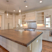 White kitchens with travertine floors