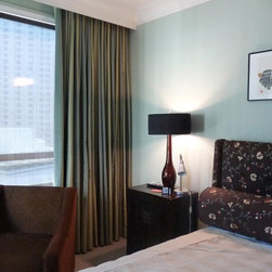 Curtains with light filtering shades underneath in comtemporary condo - Curtains