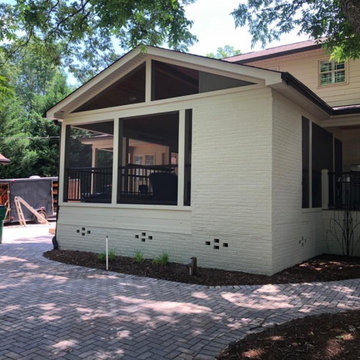 Screen porch, basketball court, and landscaping