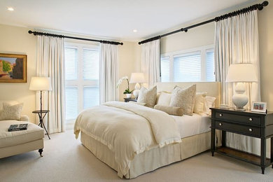 Example of a mid-sized classic master carpeted and white floor bedroom design in San Diego with white walls and no fireplace